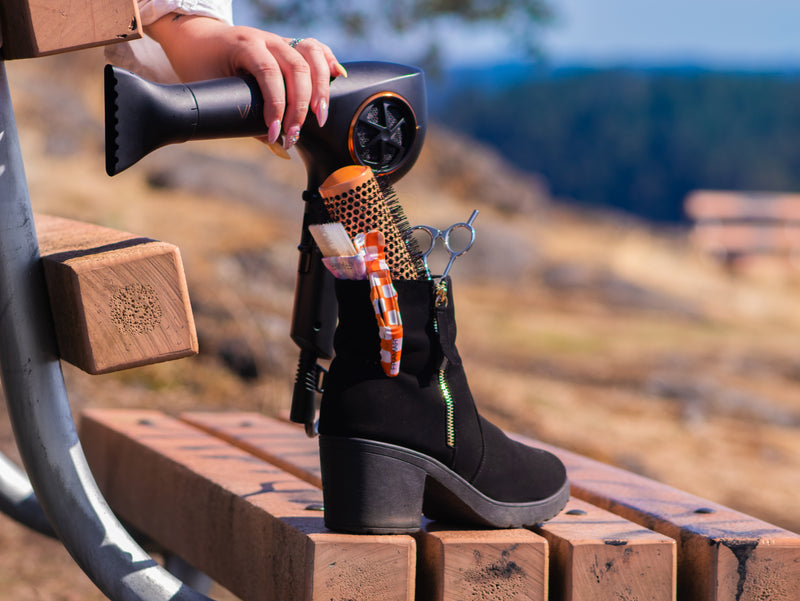 Sugarloaf Mountain-Hairstylist Reese Hobbs Nanaimo - Multinex Media-Photoshoot-Black Boot and hairdryer stock image - Centered 