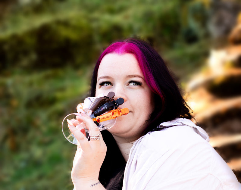 Canadian hairstylist Reese Hobbs holding a cup of hair clips with a blurred natural background. Sugarloaf Mountain Hairstylist Reese Hobbs Nanaimo - Multinex Media-Photoshoot